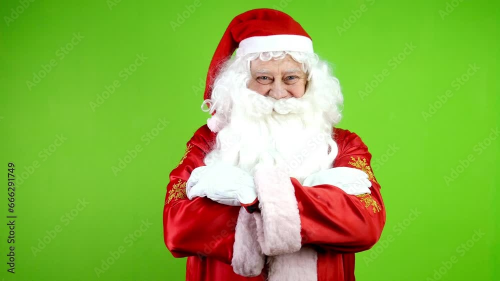 Joyful Santa Claus crossing his arms posing and looking at camera.