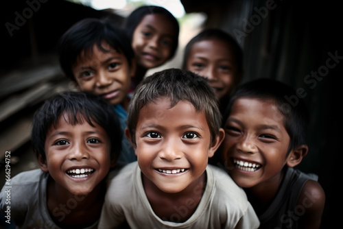 Group of Indonesian children laughing and smiling in a village. photo
