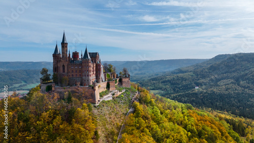 Aerial drone view of medieval Hohenzollern castle on top of hill in autumn, Baden-Wurttemberg, Germany © frolova_elena