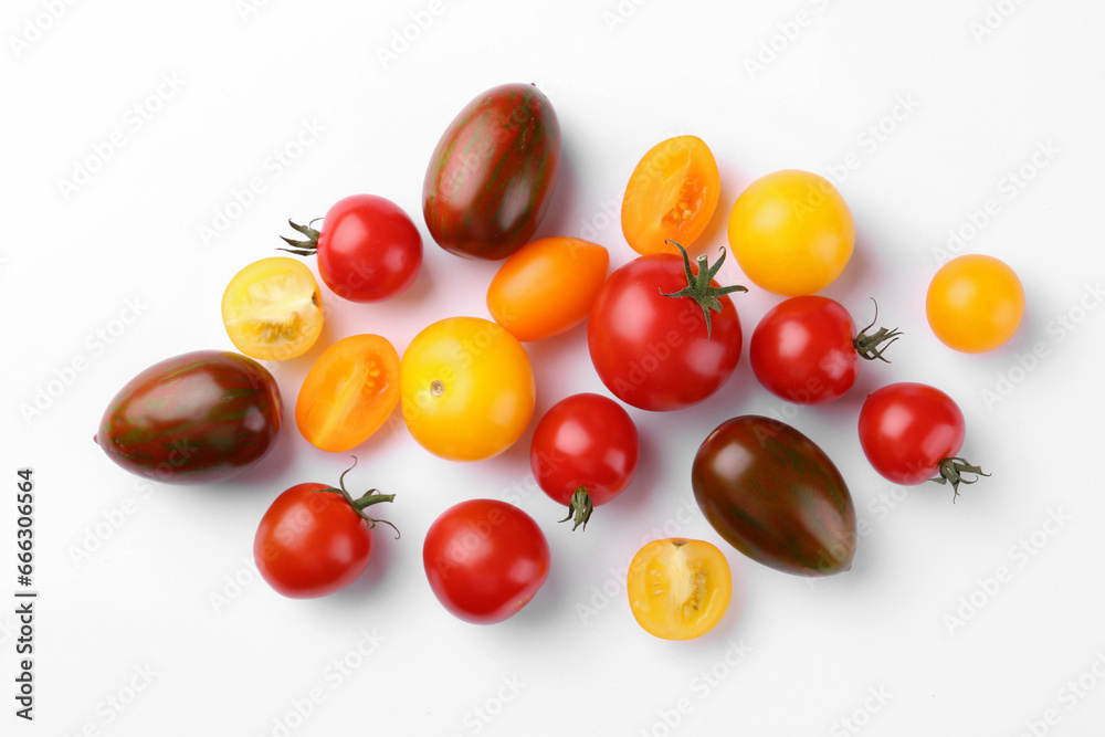 Flat lay composition with different whole and cut tomatoes on white background Flat lay composition with different whole and cut tomatoes on white background