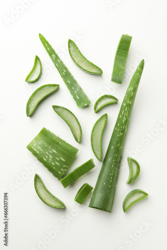 Fresh aloe vera pieces on white background, flat lay photo