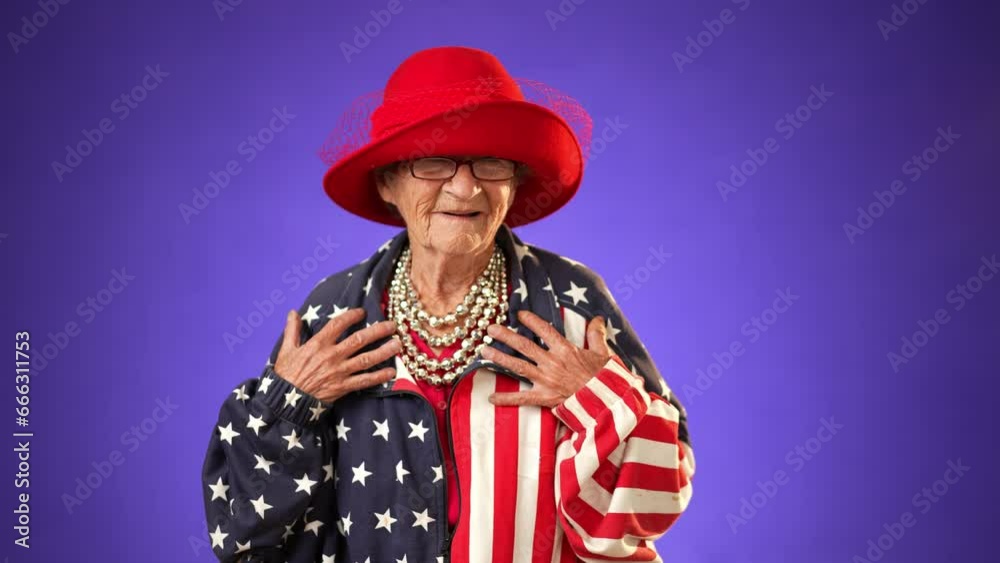 Angry, scared elderly senior old funny crazy woman with wrinkled skin and grey hair put hands out ask WHY ME, wearing US flag jacket isolated on purple background studio. People emotions Angry, scared elderly senior old funny crazy woman with wrinkled skin and grey hair put hands out ask WHY ME, wearing US flag jacket isolated on purple background studio. People emotions