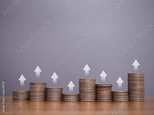 Stack of coins with arrow rising icons. The concept of business growth, Financial investment, Market stock, Profit return, Dividend and Business fund.