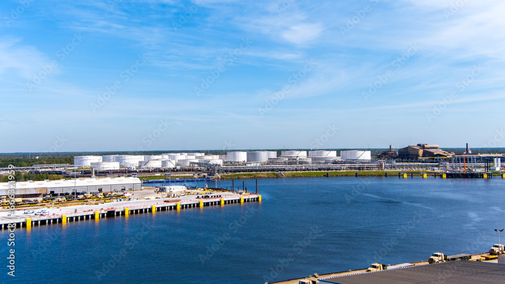 Aerial view of a Fuel Tank Storage Facility along a port in Beaumont Texas. - obrazy, fototapety, plakaty 