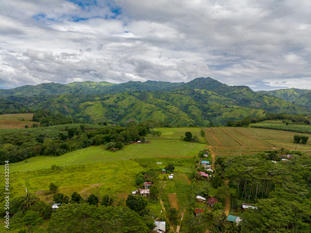 Mountain hill with rainforest and agricultural land of farmers. Mindanao, Philippines.