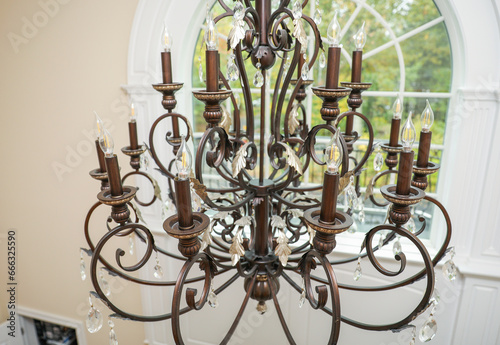 chandelier with intricate crystal details, casting elegant light patterns in a luxurious setting, epitomizing opulence, grandeur, and sophistication