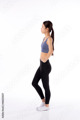 Fototapeta Naklejka Na Ścianę i Meble -  Portrait of beautiful young asian woman in sportswear showing waist and abs isolated on white background, sport and exercise for health, female slimming with confident and wellness, side view.