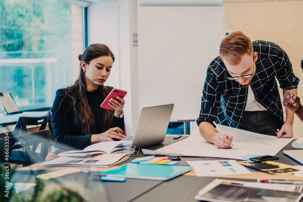 Team of diverse employees thinking on project Team of diverse employees thinking on project