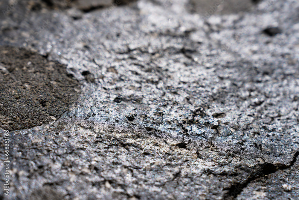 Closeup detail of black volcanic rock texture Closeup detail of black volcanic rock texture