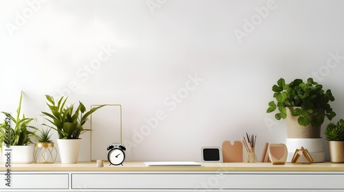 Stylish desk interior with White table background with plant and leaves. Modern home office interior panoramic banner backdrop photo