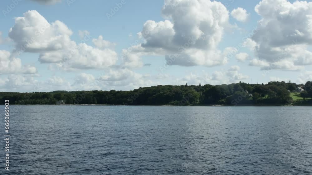  calm sea and shore with sky and beautiful clouds