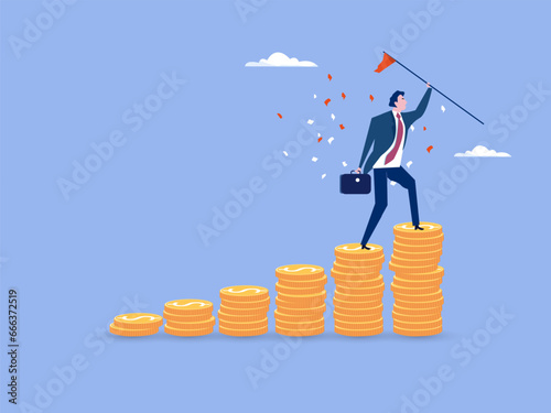 Financial success, reaching financial freedom, money achievement or earning profit or savings or investment goal concept, success businessman holding winning flag on top of money coins stack.