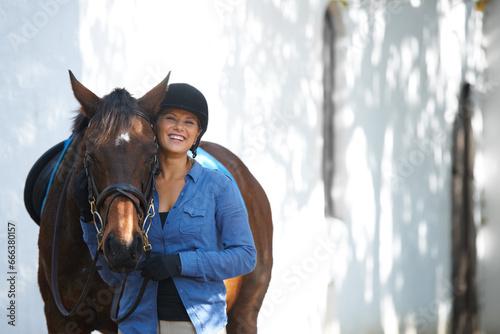 Smile, portrait and a woman with a horse for sports, farm training and riding for hobby. Happy, adventure and young rider with an animal for equestrian exercise for competition or race in nature. © Marine G/peopleimages.com