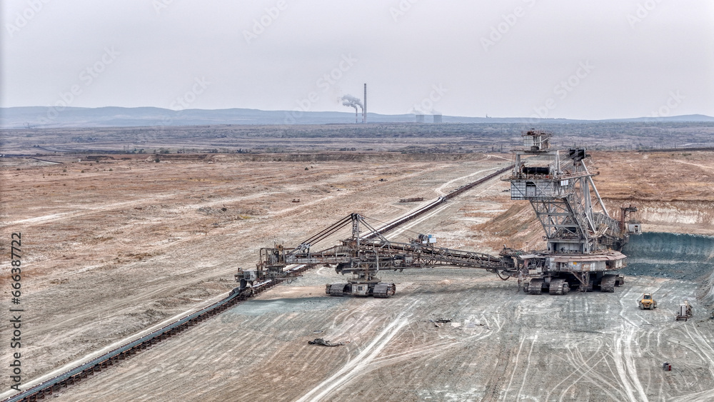 Open pit coal mine with huge backhoe digger