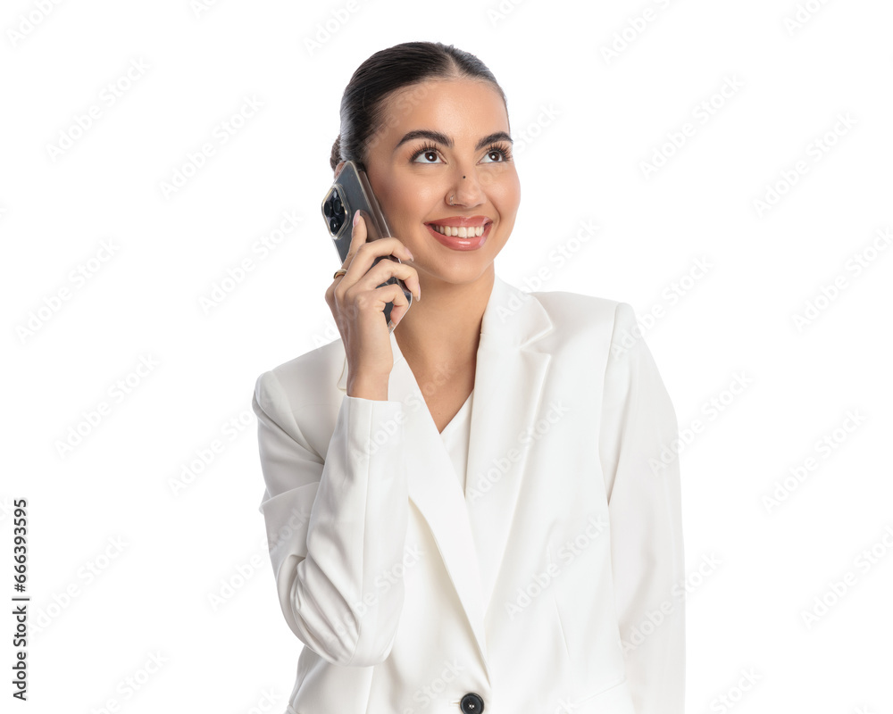 cute young girl in white suit talking on the phone and looking up cute young girl in white suit talking on the phone and looking up