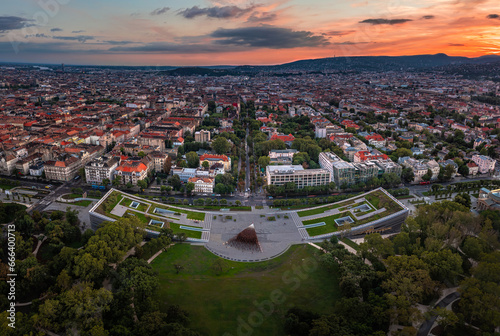 Budapest, Hungary - Aerial panoramic view of the Museum of Ethnography at City Park with the skyline of Budapest at background and colorful sunset over the capital of Hungary