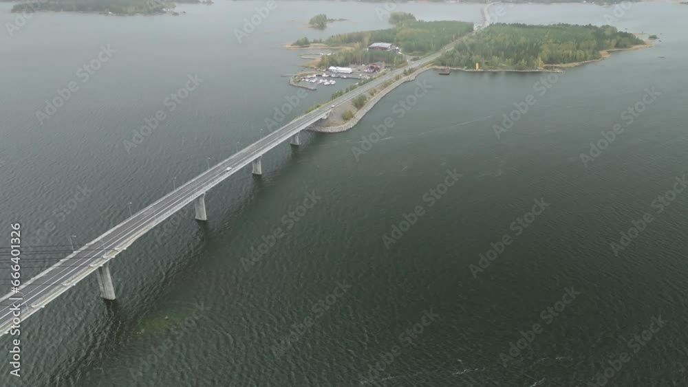 Replot Bridge To Isle Of Fjardskaret During Autumn In Vaasa, Finland. aerial pullback