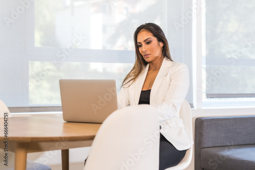Elegant and beauty businesswoman working concentrated using a laptop