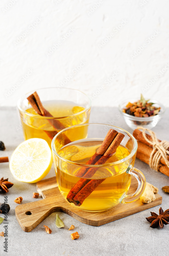 Autumn or Winter Hot Tea, Herbal Tea with Spices on Bright Background Autumn or Winter Hot Tea, Herbal Tea with Spices on Bright Background