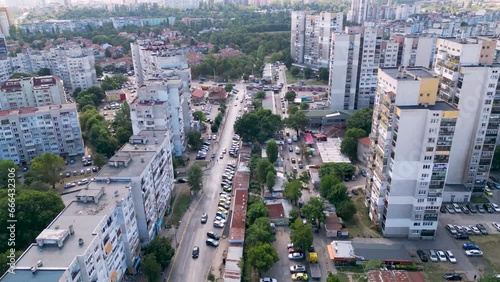 Aerial drone flyover footage of communist era buildings in Eastern Europe. High angle tracking shot of blocks in Sofia Bulgaria. 4k video capturing boring residential buildings from communist times.
 photo