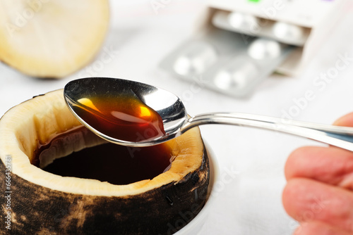 even children can take a teaspoon of black radish syrup with honey for colds and coughs photo