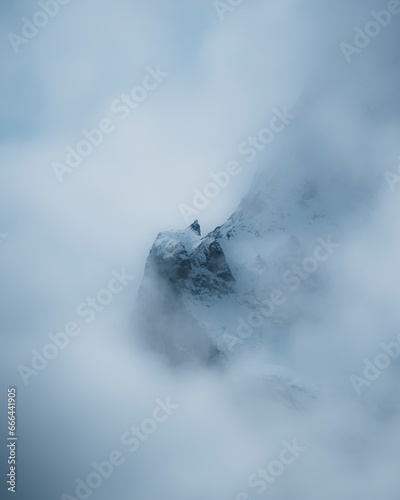 View of mountain peak in the clouds in Rosenlaui, Switzerland.