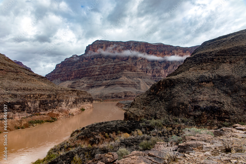 The Grand Colorado River at the western gateway to the Grand Canyon National Park is the border between the U.S. states of Arizona and Nevada. The Grand Colorado River at the western gateway to the Grand Canyon National Park is the border between the U.S. states of Arizona and Nevada.
