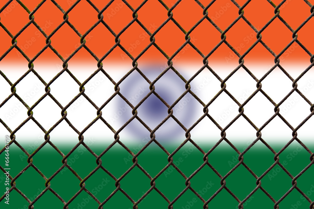 A steel mesh against the background of the flag India. A steel mesh against the background of the flag India.