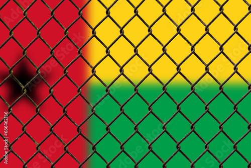 A steel mesh against the background of the flag Guinea-Bissau.