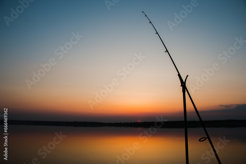 Fishing rod at sunset close-up. High quality photo