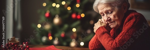Lonely elderly woman Grandmother during Christmas missing loved ones. Scene of sadness, trauma and loss.
