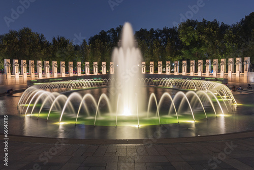 Illuminated World War II Memorial at nighttime on the National Mall in Washington DC, United States