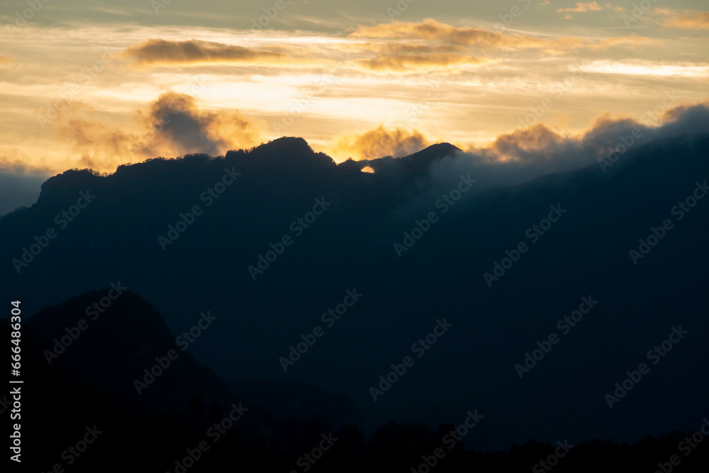 Rolling clouds over mountain