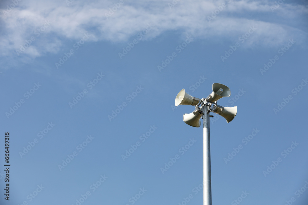 Whire horn speaker with cloud on blue sky background.. Whire horn speaker with cloud on blue sky background..