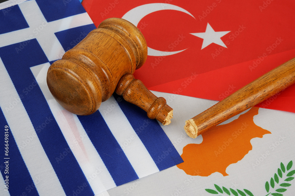 Conflict between Greece and Turkey about Cyprus concept. Flags of Turkey, Greece and Cyprus with broken judge gavel.