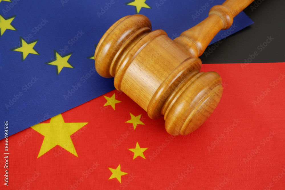 China and European Union agreement concept. Judge gavel and flags of EU and China.
