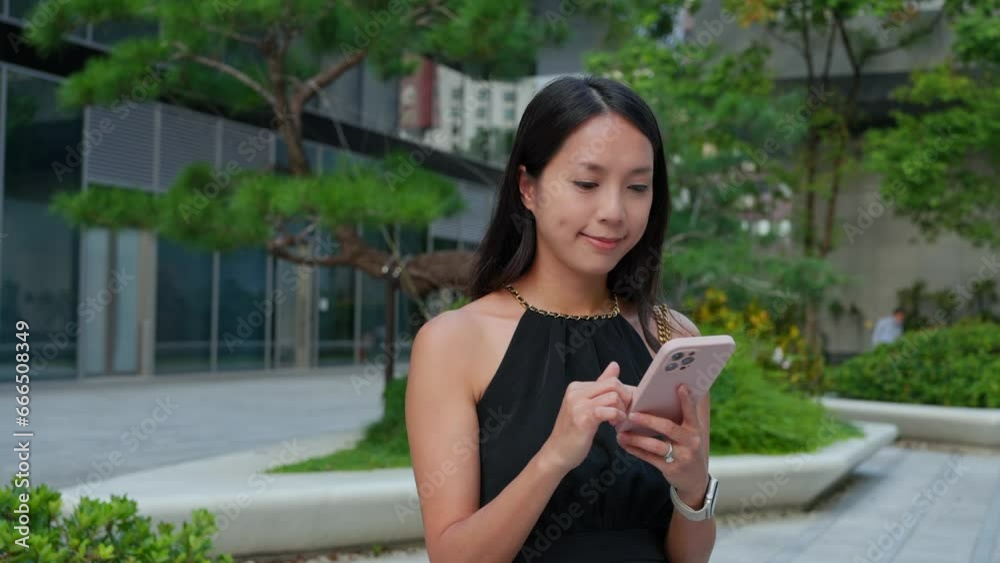 Woman use of mobile phone at outdoor Woman use of mobile phone at outdoor