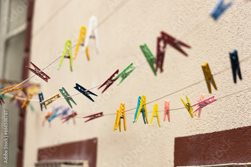 Multi-colored clothespins on a rope