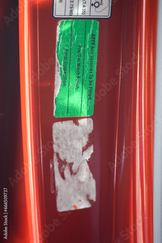 Portrait of worn stickers in a car door