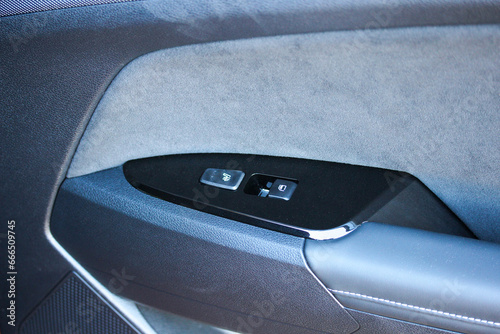 New vehicle door handle with power window and seat heater buttons