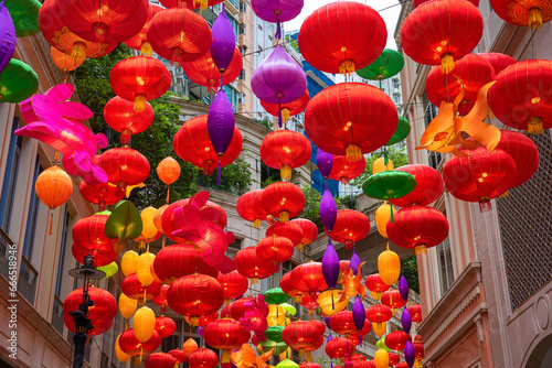 Street of Hong Kong in the morning decorated with red lanterns for celebrate the Chinese New Year and crowded street in the center of Hong Kong at day. Decoration for chinese new year in Hong Kong. 