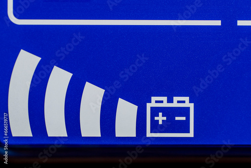 Closeup of blue digital display on uninterruptible power supply with automatic voltage stabilizer photo