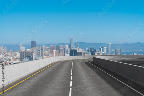 Empty urban asphalt road exterior with city buildings background. New modern highway concrete construction. Concept way to success. Transportation logistic industry fast delivery. San Francisco. USA.
