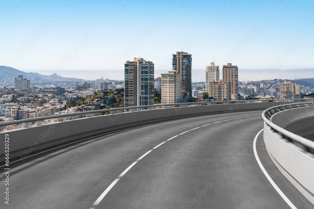 Empty urban asphalt road exterior with city buildings background. New modern highway concrete construction. Concept way to success. Transportation logistic industry fast delivery. San Francisco. USA.