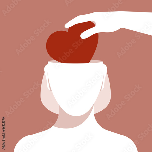Male hand put heart inside female head. Woman silhouette without face. Abstract human head template. Woman front view. Mental health, brainwash, relationship and social issues concept.