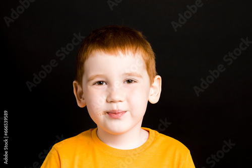 portrait of a child with red hair