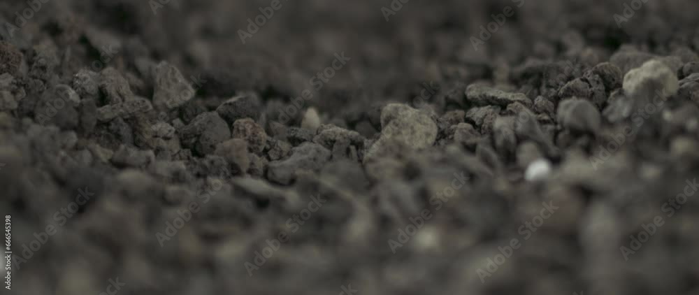 soil slowmotion moving falling and bouncing with dust and particles