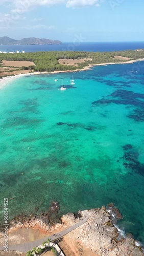 Aerial view Cala Romantica beach. Spain. Mallorca. Transparent water. Slow motion. Vertical video for social network. 4K