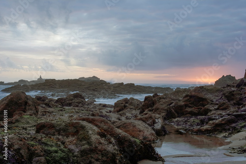 Rocky sea beach at sunset