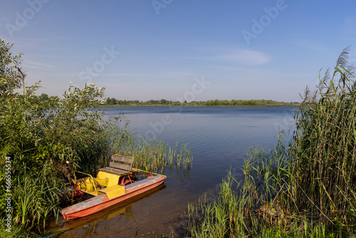 one old catamaran for walking on the lake in the summer season © rsooll